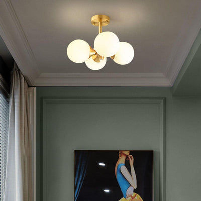 Lustre à 4 lumières avec cadre doré moderne de style mi-siècle et globe en verre pour salon 