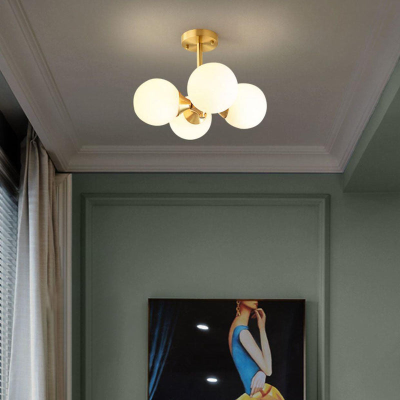 Lustre à 4 lumières avec cadre doré moderne de style mi-siècle et globe en verre pour salon 