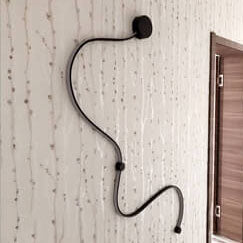 Moderne lange Aluminium-Schlangenform 1-Licht gebogene LED-Wandleuchte 