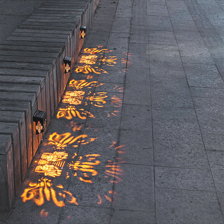 Modern Creative Hollow Plastic Waterproof Solar LED Outdoor Wall Light