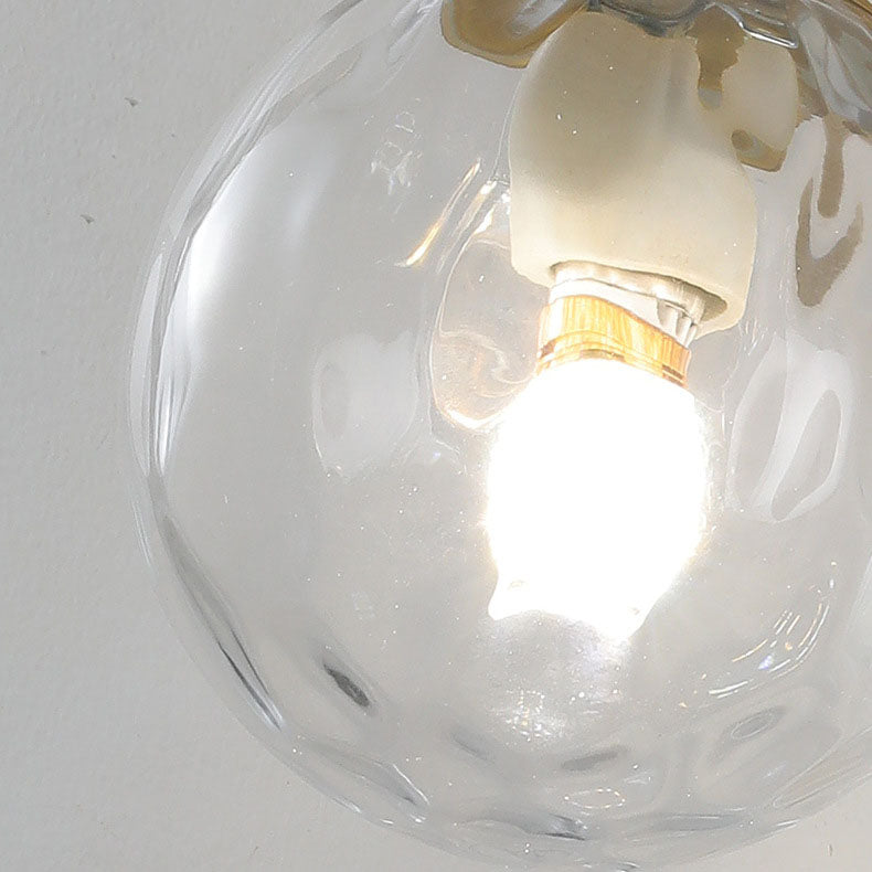Aplique de pared de 1 luz con esfera de vidrio de lujo moderno y base de cobre para dormitorio 