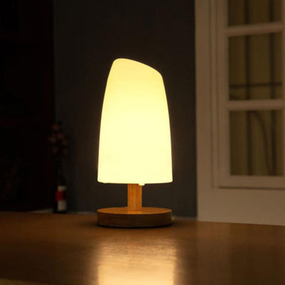 Kreative LED-Tischlampe mit PE-Säule und Holzsockel