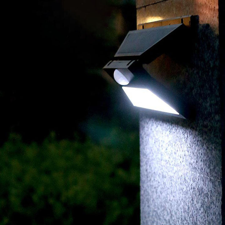 Aplique de pared para patio exterior LED solar impermeable con sensor de movimiento, cuerpo plegable en forma de mariposa de plástico ABS y PVC, estilo minimalista moderno 
