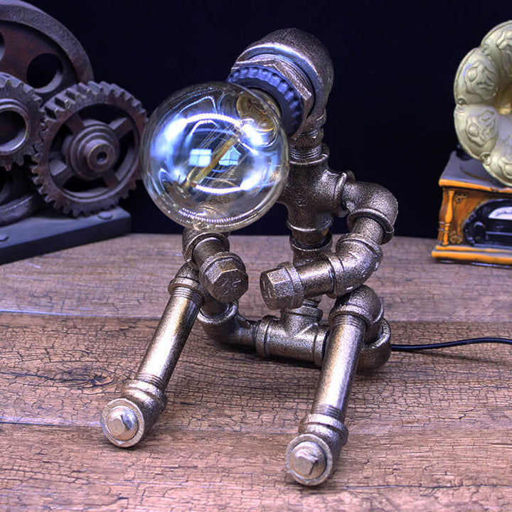 Lampe de table robot assis en fer industriel créatif 