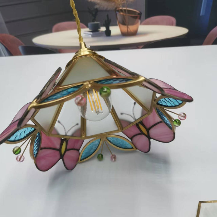 Moderne nordische 1-flammige Pendelleuchte aus Kupfer mit Schmetterlings-Buntglas in Kegelform für das Wohnzimmer 