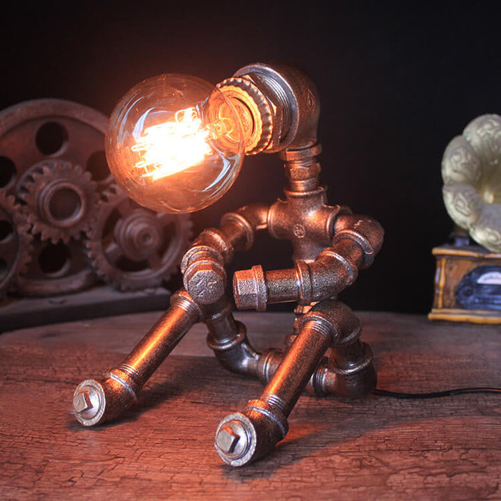 Lampe de table robot assis en fer industriel créatif 