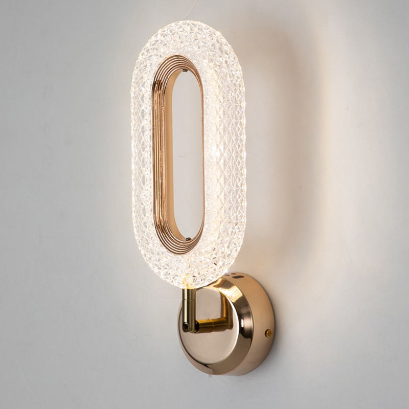 Lámpara de pared LED con pantalla de acrílico y anillo de hierro en oro rosa de lujo moderno para dormitorio 