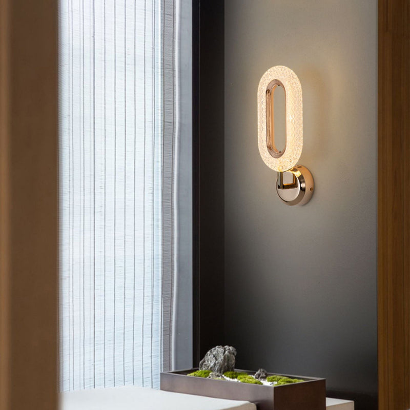Lámpara de pared LED con pantalla de acrílico y anillo de hierro en oro rosa de lujo moderno para dormitorio 