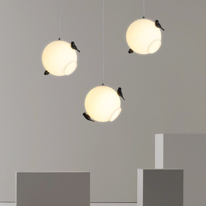 Modern Glass Ball with Standing Birds 1-Light Pendant Light