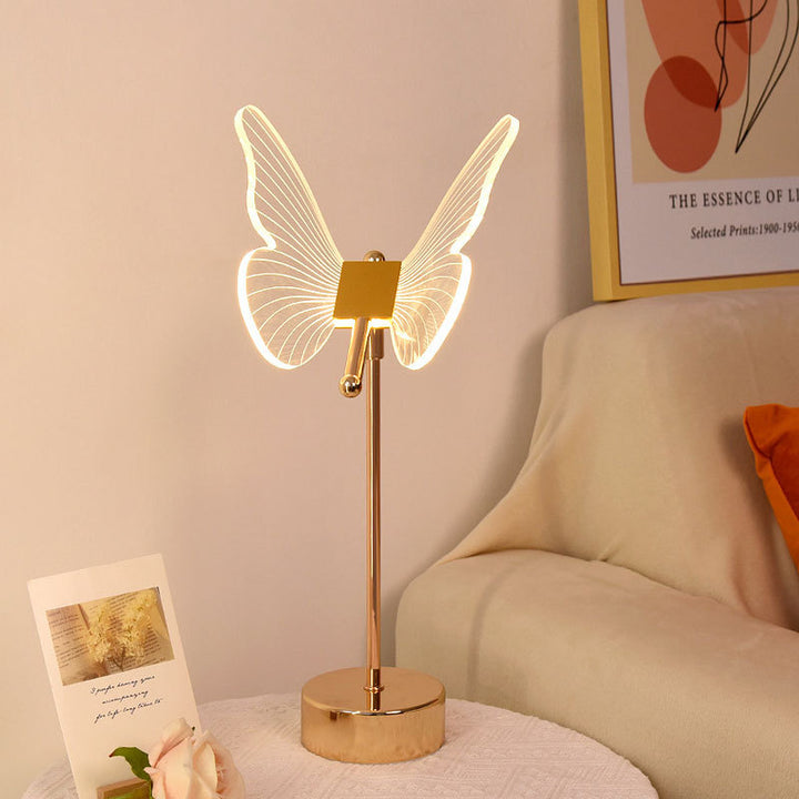 Moderne minimalistische LED-Tischlampe aus Acryl mit Blumen- und Schmetterlingsmotiv in Gold für das Schlafzimmer 